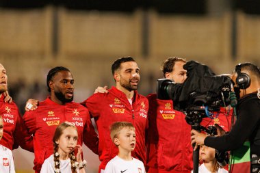 Joseph Mbong ve Zach Muscat, 2026 Dünya Kupası eleme maçında Malta ve Polonya milli takımları arasında görüldü (Maciej Rogowski / Ball Raw Images)