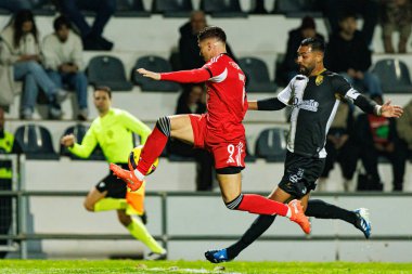 Franjo İvanoviç ve Franco Romero, Taca de Portugal maçında SC Farense ve SL Benfica takımları arasında Estadio Sao Luis 'de (Maciej Rogowski / Ball Raw Images)
