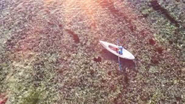 Young lady paddling the kayak in the sea with lots of splashes — Stock Video