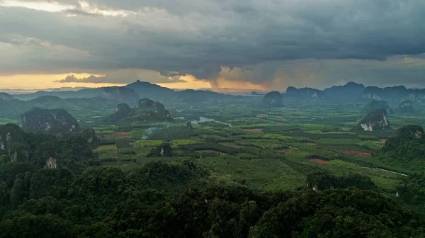 AERIAL. Epic and dramatic view of mountains in the south part of Thailand after sunset and before rain come. Camera moving above peaks mountains, huge clouds. — Stock Photo, Image