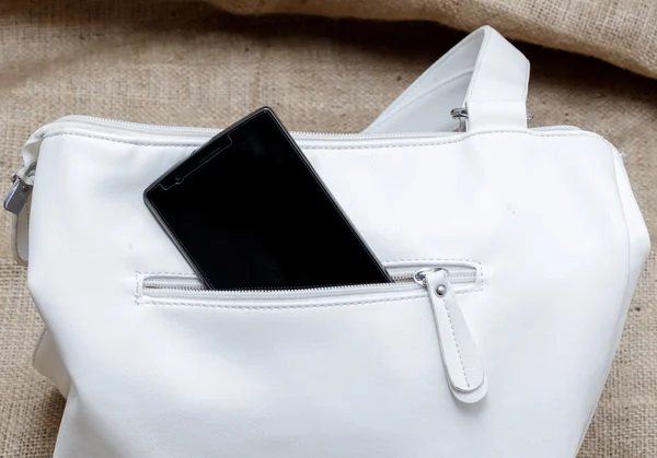 Smartphone, bolso femenino, blanco — Foto de Stock