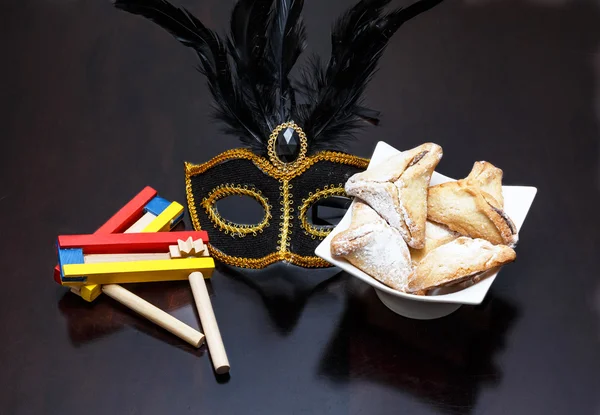 Purim holiday cookies, Colorful noisemaker, and Purim Mask — Stock Photo, Image