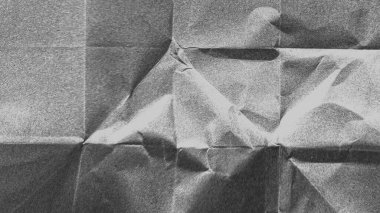 Buruşmuş kağıt dokusu siyah arkaplan. Beyaz kırışık çarşaf. Kaplama efekti