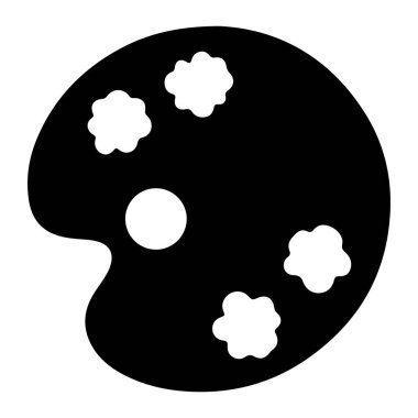 Yuvarlak şekilli ve sol tarafında başparmak deliği olan basit bir siyah boya paleti. Palette düzensiz çiçek şeklindeki dört beyaz boya damlası ve merkezinde bir dairesel delik var. Arkaplan düz beyaz.