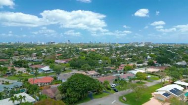 Aerial drone view of a residential neighborhood in Fort Lauderdale, Florida. This footage highlights the relaxed suburban lifestyle and coastal charm of South Florida, perfect for real estate, travel, or city landscape projects.