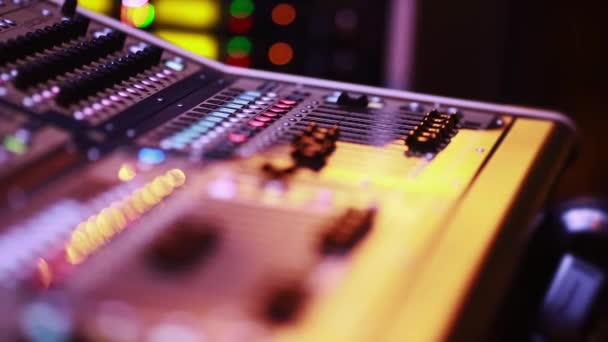 Cool shot of Digital Audio Console Fader by stage during performance — Stock Video