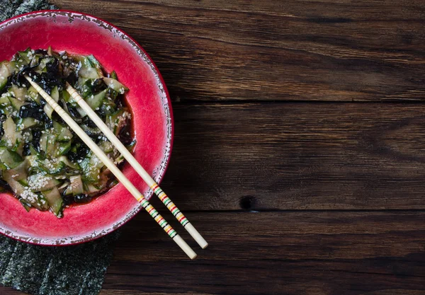 stock image Asian salad with seaweed nori, cucumber, sesame seeds and soya