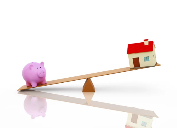 Piggy com modelo de casa em Seesaw — Fotografia de Stock