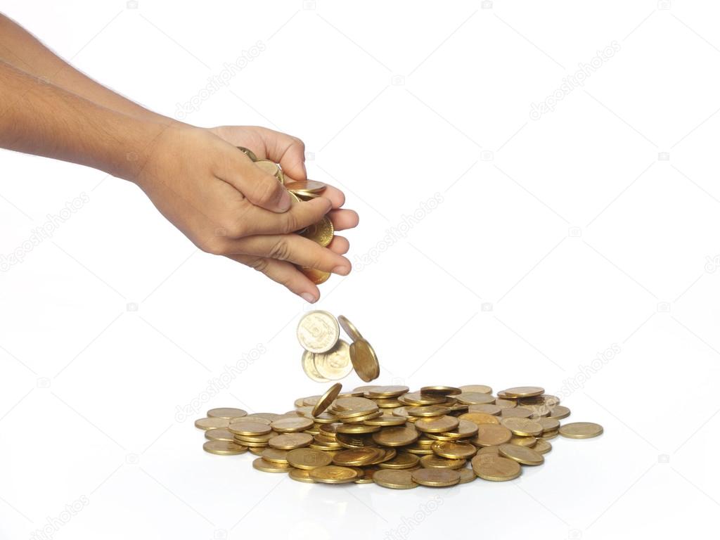 Man Hands Droping the Gold Coins