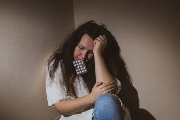 Young woman with strong anxiety and depression using a depress pills during covid-19, coronavirus lockdown