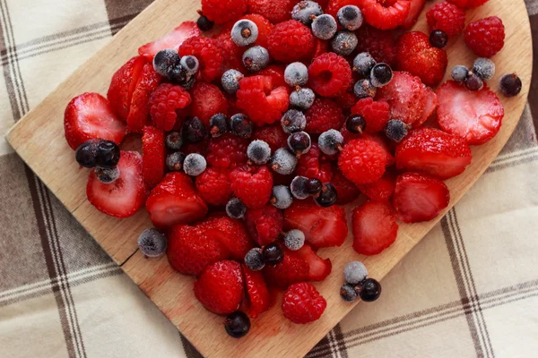 Berries on wooden table — Stock Photo, Image