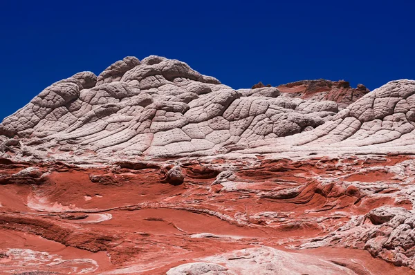 Piedra arenisca colorida en bolsillo blanco — Foto de Stock