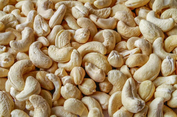 Cashewnötter indiska mutter bakgrund - konsistens — Stockfoto