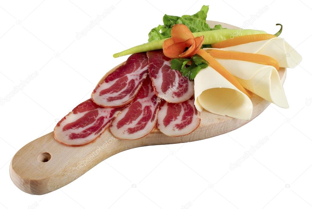 Prosciutto antipasto decorated raw meat with cheese isolated on white background