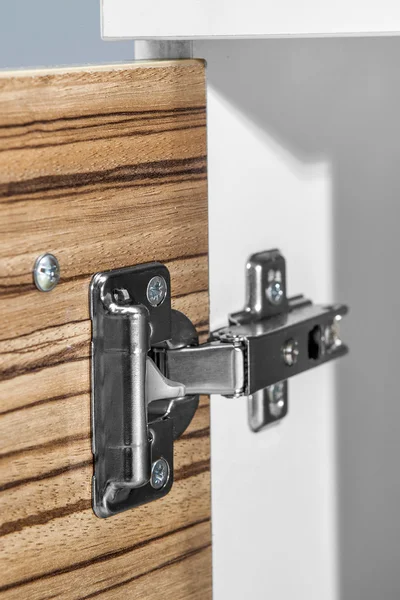 Closeup of furniture cabinet modern clip hinge with amortization - citchen slow motion hardware — Stock Photo, Image