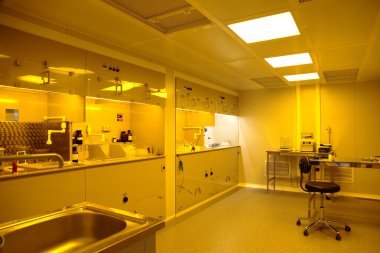 Clean room in nuclear research centre, photolithography clipart