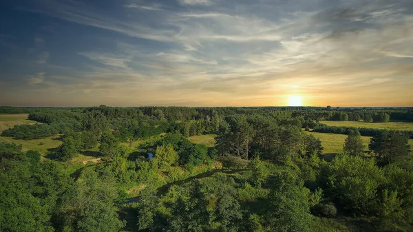 Low flyover over a small wild river on a summer day, river Grabia, Poland.