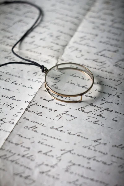 Old monocle on old original handwritten Polish letter — Stock Photo, Image