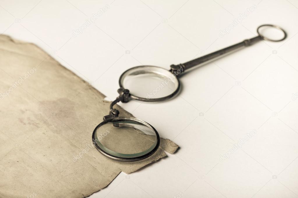 Old pince-nez on very old (1871) blank paper