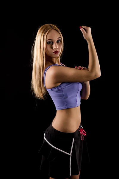 Beautiful fitness woman on black background — Stock Photo, Image