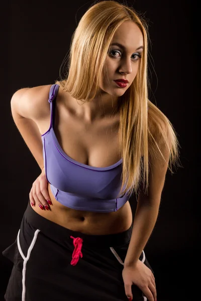 Beautiful fitness woman on black background — Stock Photo, Image