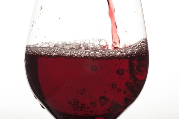 Verre et vin rouge spash — Photo