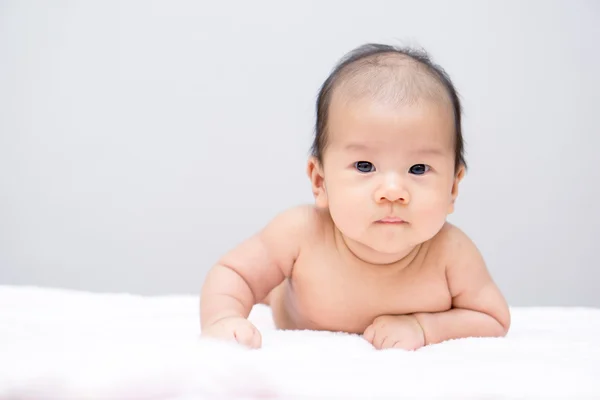 Asian baby lying on stomach — Stock Photo, Image