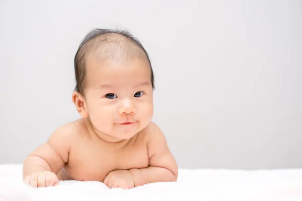 Asian baby lying on stomach — Stock Photo, Image