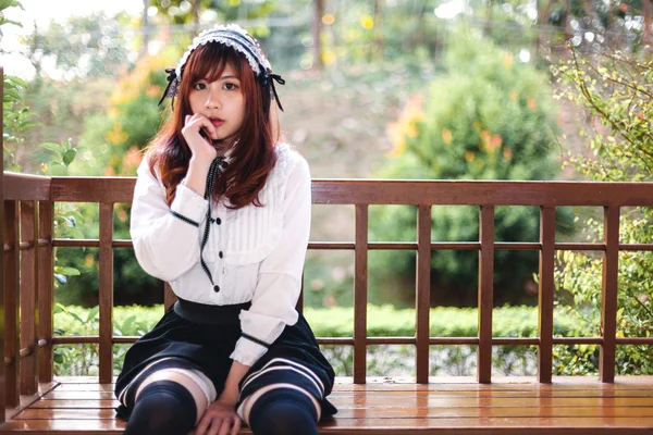 Charming Asian girl in japanese maid costume — Stock Photo, Image