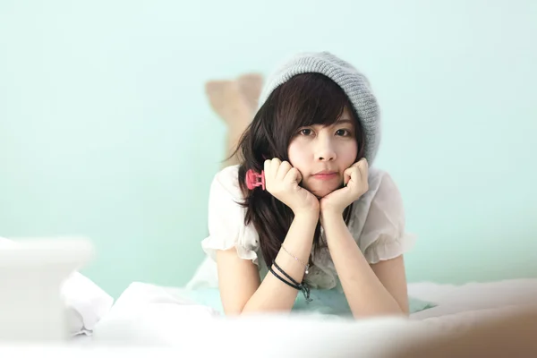 Charming Asian girl in pajamas — Stock Photo, Image