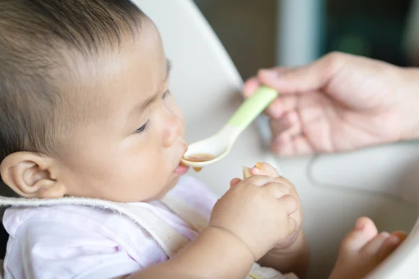 Asian baby feeding time