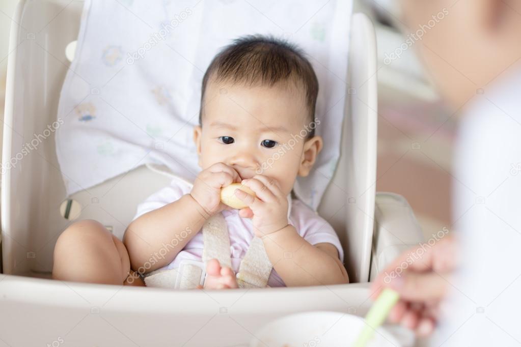 Asian baby feeding time