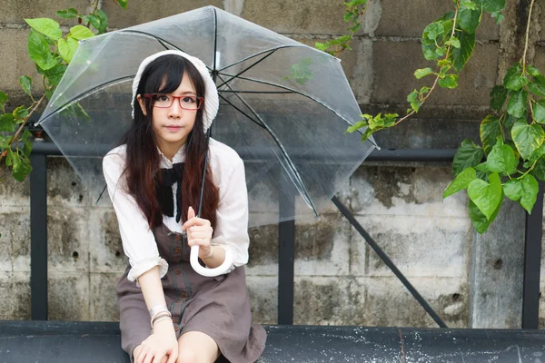 Asian girl with umbrella — Stock Photo, Image