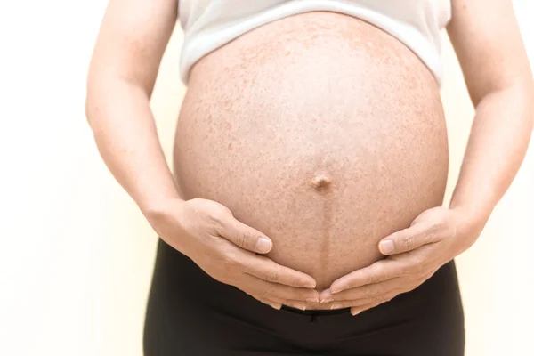 Allergy on pregnant belly — Stock Photo, Image