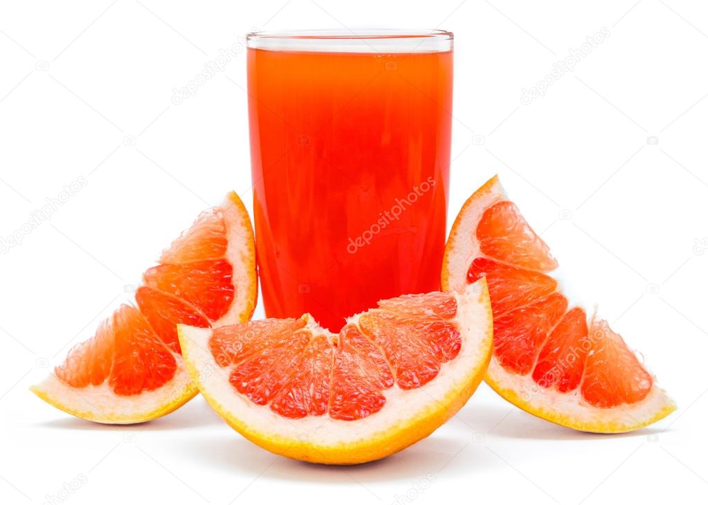 glass of juice and grapefruit slices