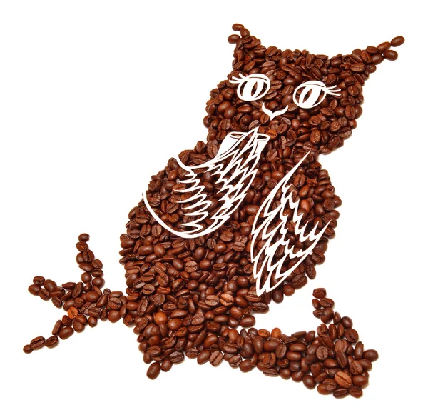 Сова из кофейных зерен — стоковое фото
