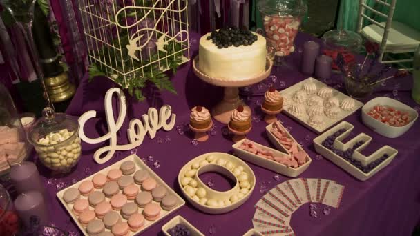 View of dessert wedding table with candles — Stock Video