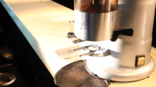 Barista takes ground coffee from grinder — Stock Video