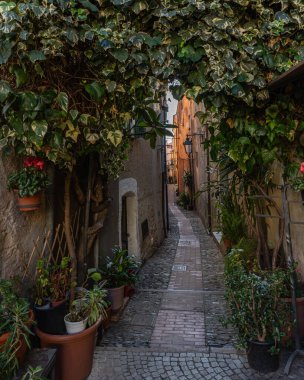 Colorful alley in Cervo, an historic small village in Liguria Region and popular tourist destination, Italy