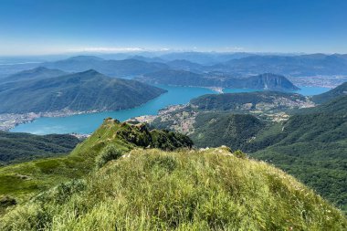 Wide panoramic view of Lugano Lake from the top of Monte Generoso, Switzerland