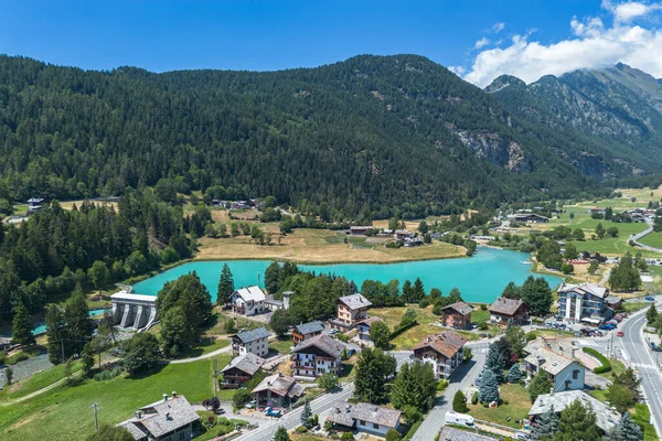 Aerial view of Val d'Ayas with Brusson lake during summer season, Aosta Valley, Italy