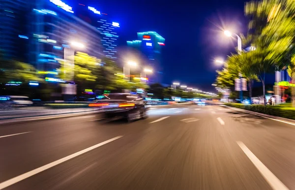 A quick taxi in the city of night — Stock Photo, Image