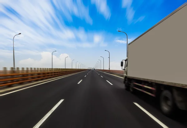 Truck on a fast express road, motion blur — Stock Photo, Image