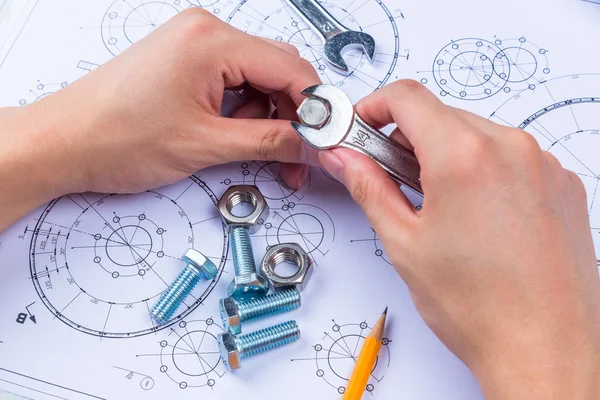 Tools and mechanisms detail on the background of technical drawings — Stock Photo, Image