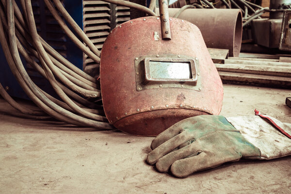 Electric welding machine, electric wire, masks, gloves and tongs, are very old