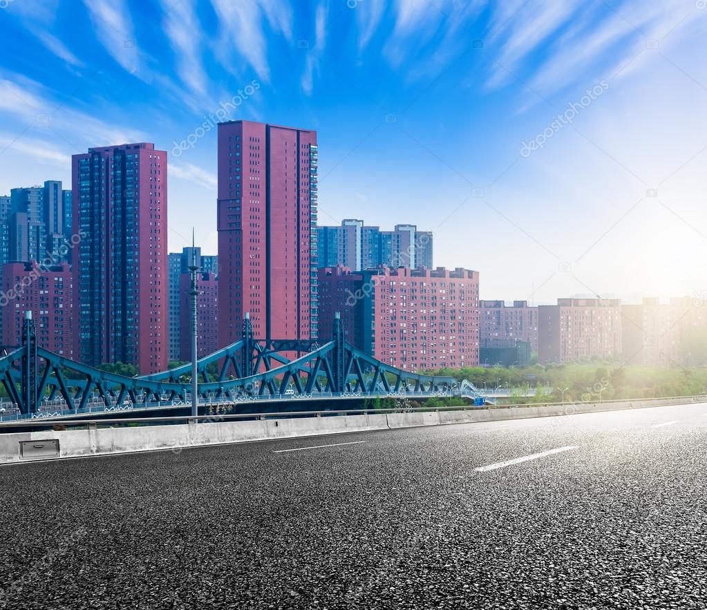 The city and the road in the modern office building background Stock Photo  by ©fanjianhua 92539646