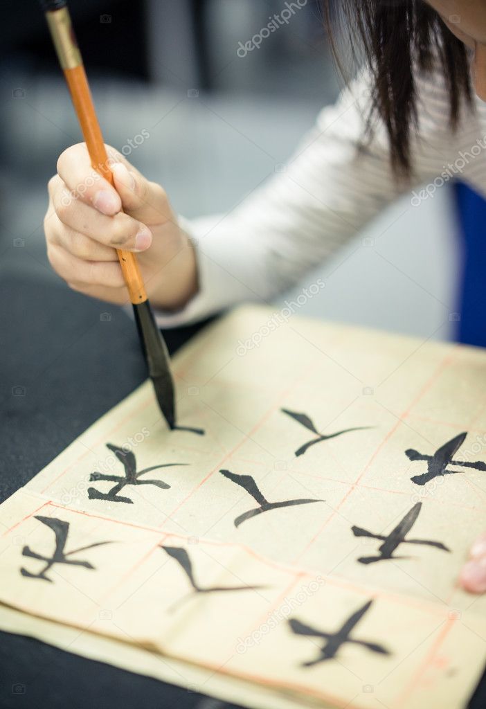 Chinese children learn to write Chinese characters, calligraphy is the traditional culture of China