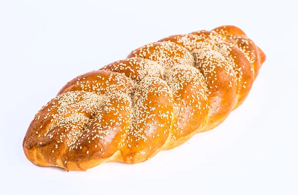 Two whole fresh challah bread with poppy and sesame seeds on a w — Stock Photo, Image