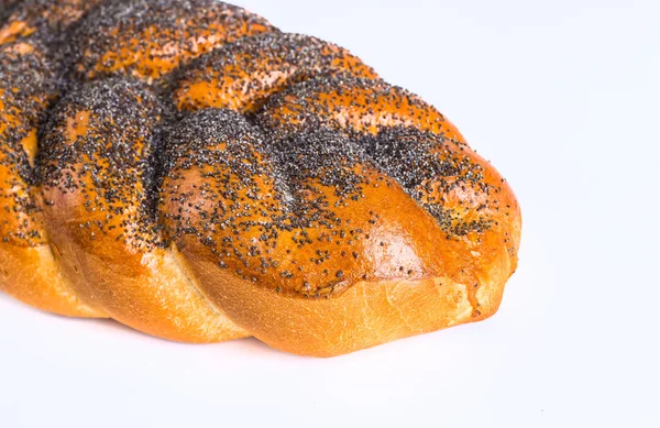 Two whole fresh challah bread with poppy and sesame seeds on a w — Stock Photo, Image