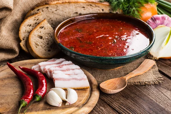 Ukrainian beetroot soup - borscht, on napkin, on wooden backgrou — Stock Photo, Image